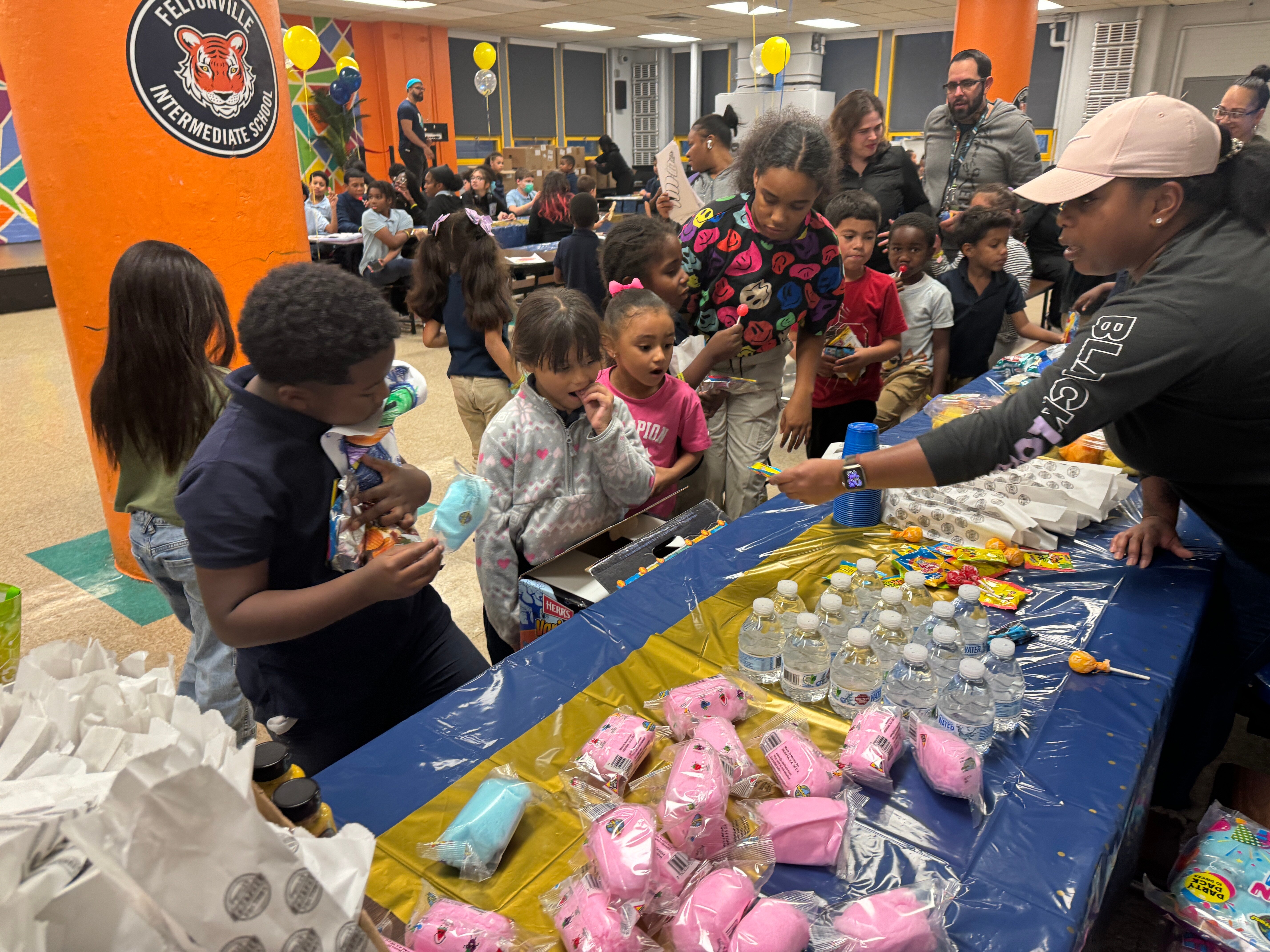 children approaching snack table